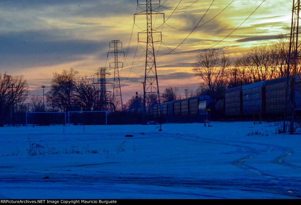 Train passing by at the sunset